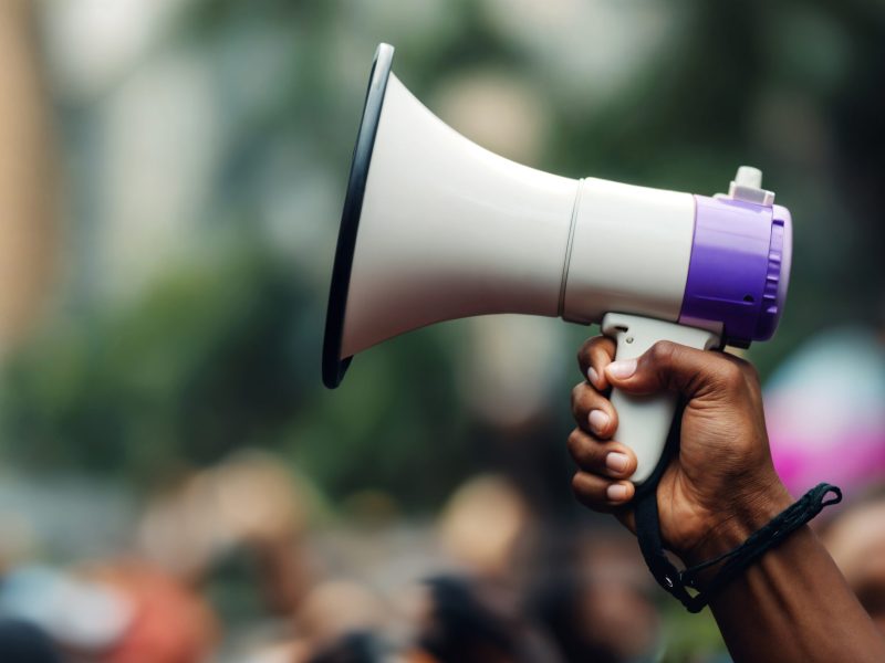 hand-holding-megaphone-protest